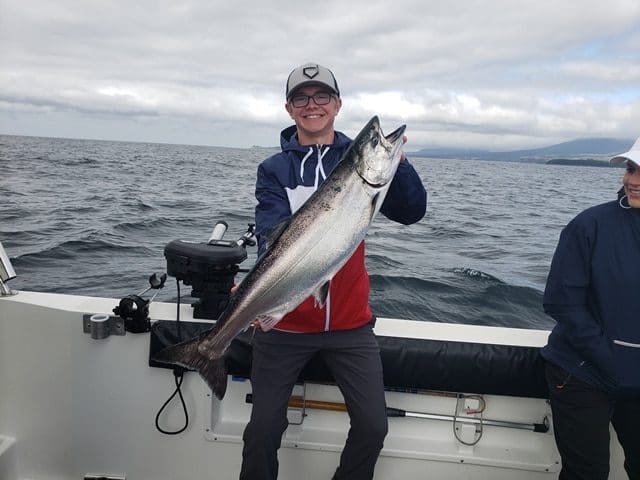 June 20, 2019 - Big Blue Charters Fishing Guest lands huge Alaska Salmon! 