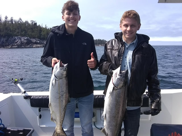 July 4, 2019 - Young fishermen with Alaska Salmon.