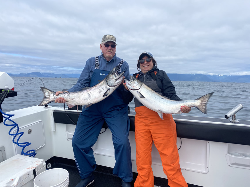 Big Blue Charters guests holding nice Salmon.  Sitka is Alaska's finest Salmon fishing. 