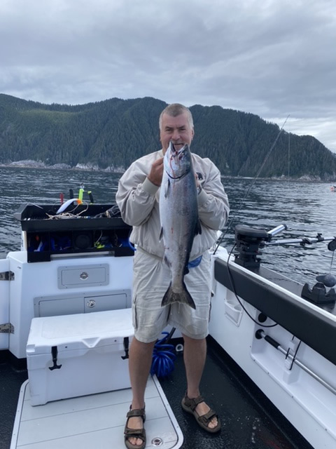 Big Blue Charters Alaska Fishing guest with nice Salmon.